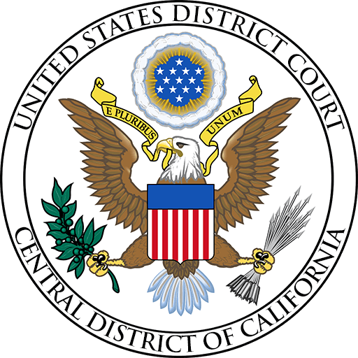 Emblem of the united states district court for the central district of california featuring a bald eagle holding an olive branch and arrows, with a shield on its chest, surrounded by a ring with the court's name.