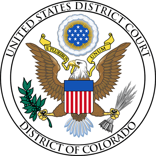 The emblem of the united states district court for the district of colorado, featuring an eagle with outstretched wings, holding a banner with the phrase "e pluribus unum," perched atop a striped shield and surrounded by a ring of stars and olive branches.