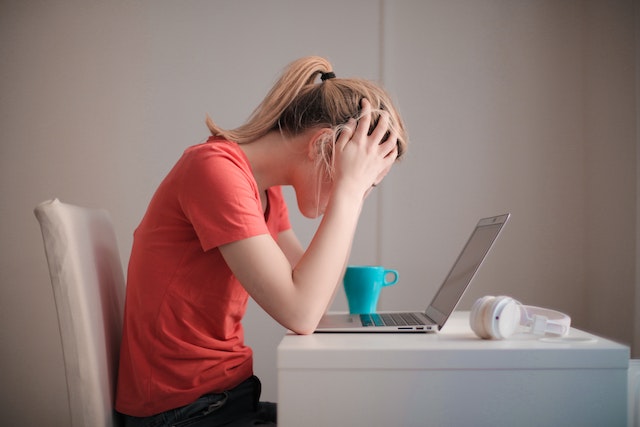 woman stressed at computer