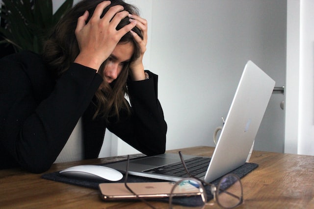 stressed woman in front of computer