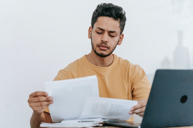 man checking his credit report