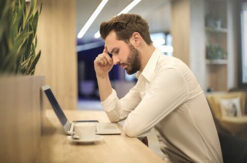 stressed man at computer