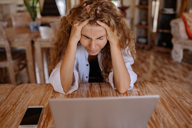 stressed out woman at computer