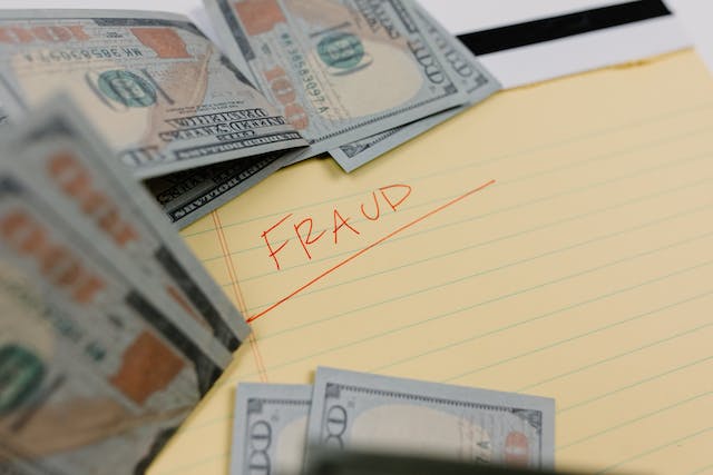 the word fraud surrounded by money