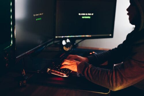 man hacking computer