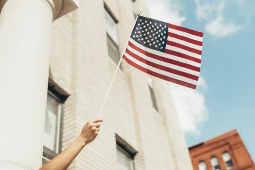 person holding american flag