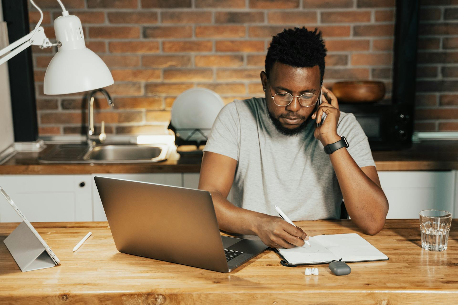 man at desk looking at document