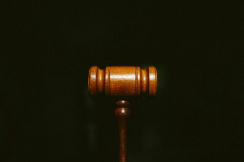 brown gavel agaisnt black background