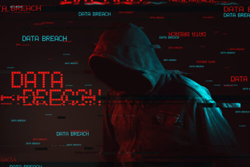 Data breach concept with faceless hooded male person, low key red and blue lit image and digital glitch effect